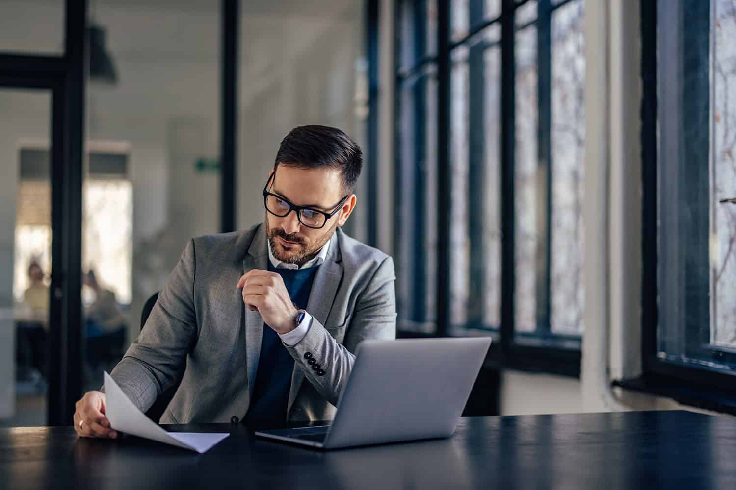 Focused adult man, making sure his client has a good insurance.